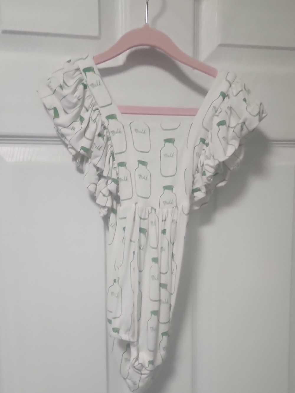 Kate Quinn Milk Print Cross Back Onesie 2T